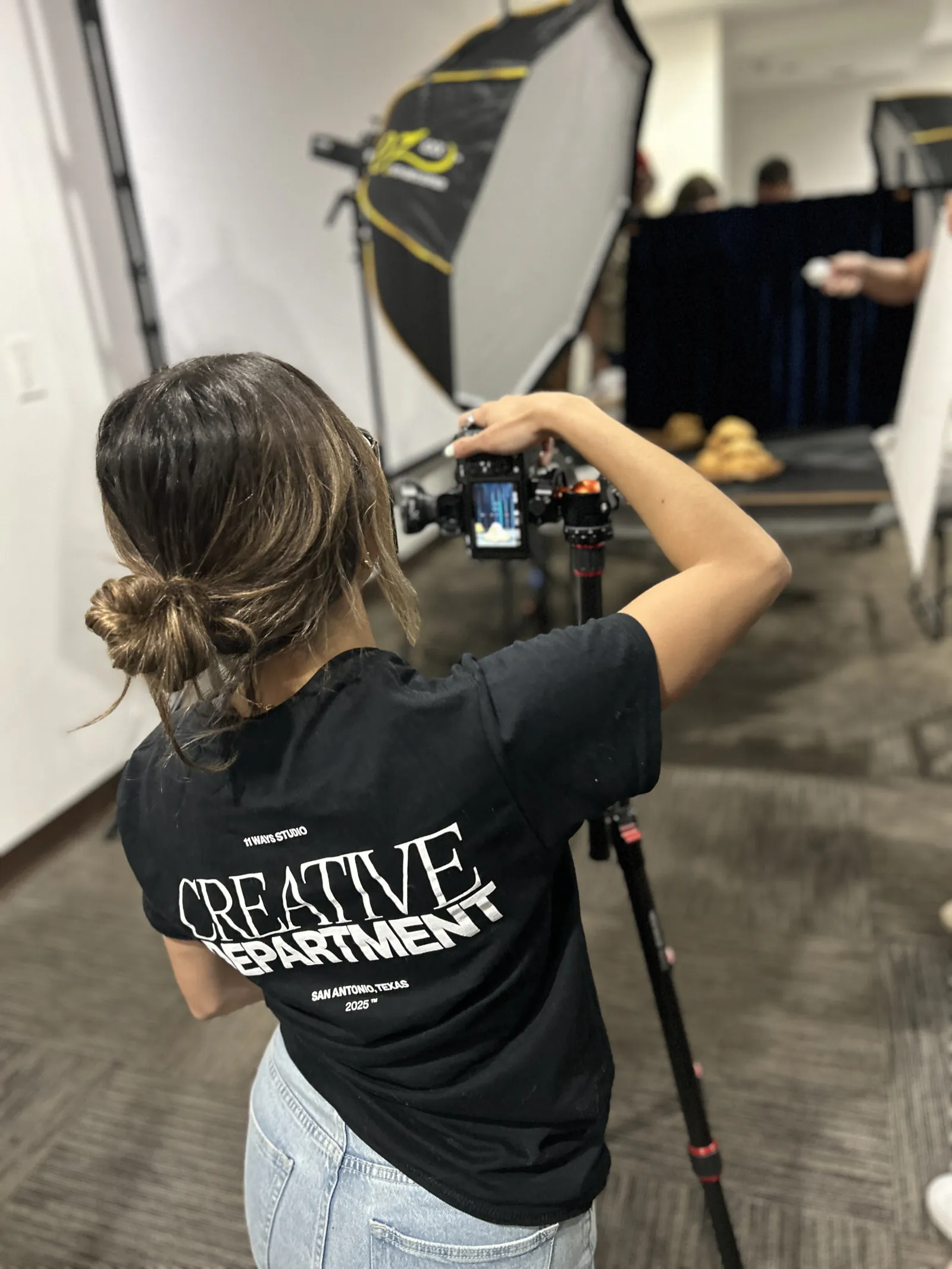 Shooting under a softbox in an Eleven Ways Creative Department tee